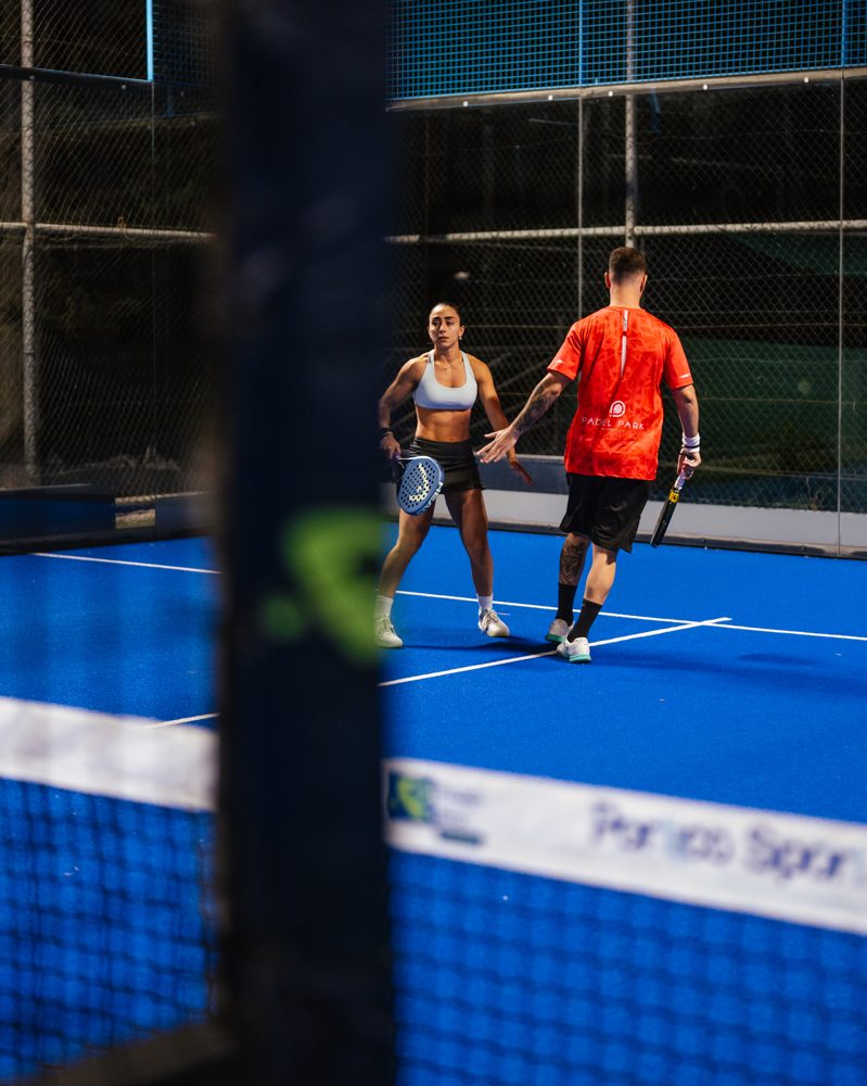 Doubles partners high-fiving after a point