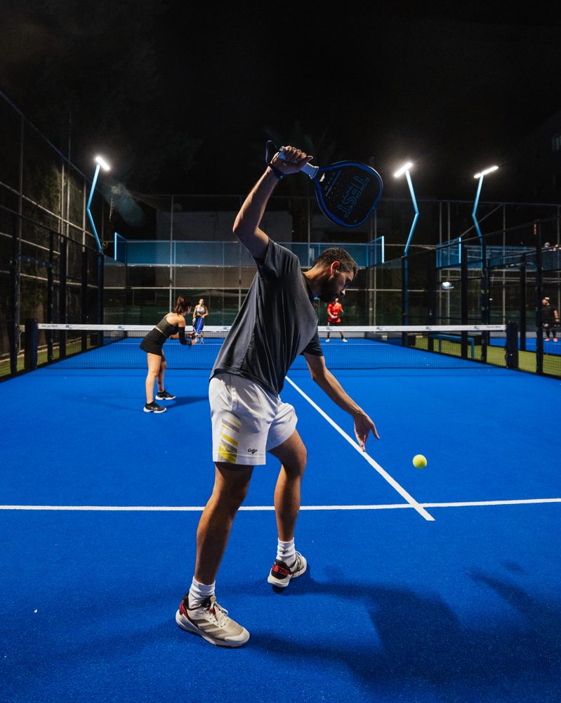 Player in full swing during a serve